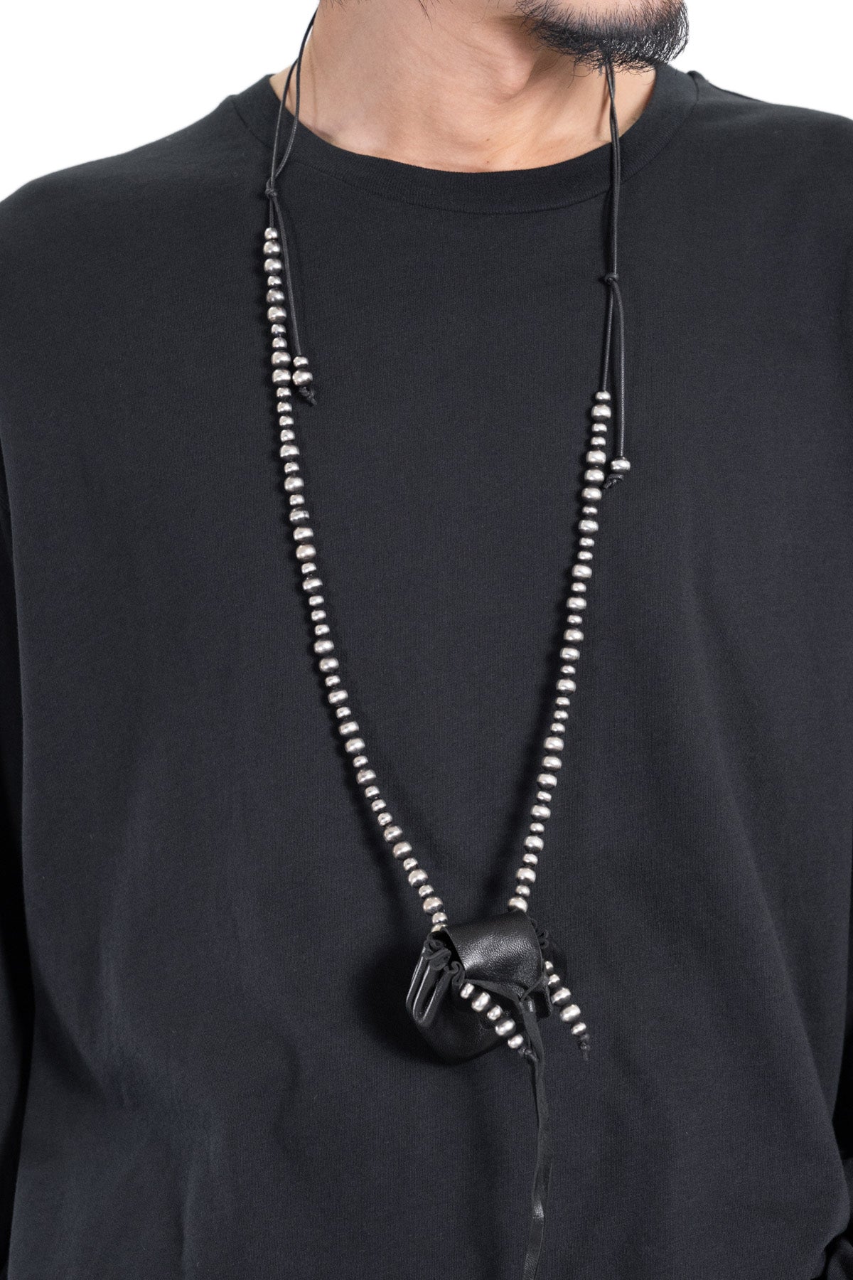 SINDRI SILVER NECKLACE WITH SMALL LEATHER BAG PENDANT
